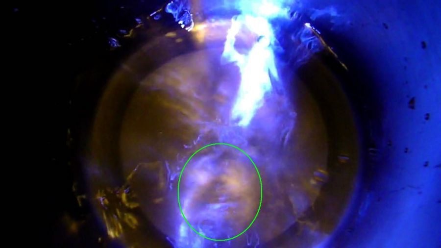 Clear water and LED flashlight. Image highlighted within green circle.
